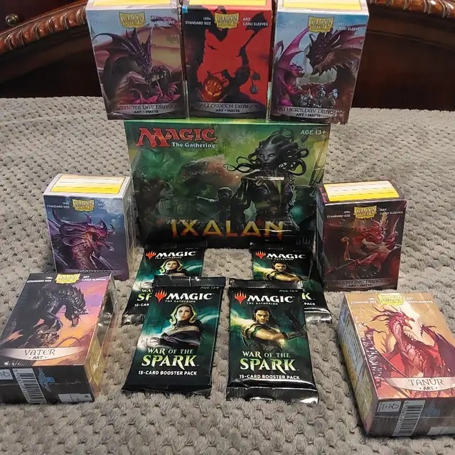 Magic Ixalan bundle and 8 Dragon Shield sleeves (20th anniversary), 10 packs MTG War of the Sparks - 1 - 1733548314980_1000002692