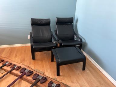 Photo of Two like new leather Poang chairs with an ottoman - 2