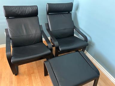 Photo of Two like new leather Poang chairs with an ottoman - 1