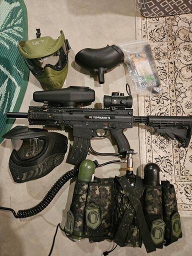 Photo of Tippman paintball gun and accessories.  - 1