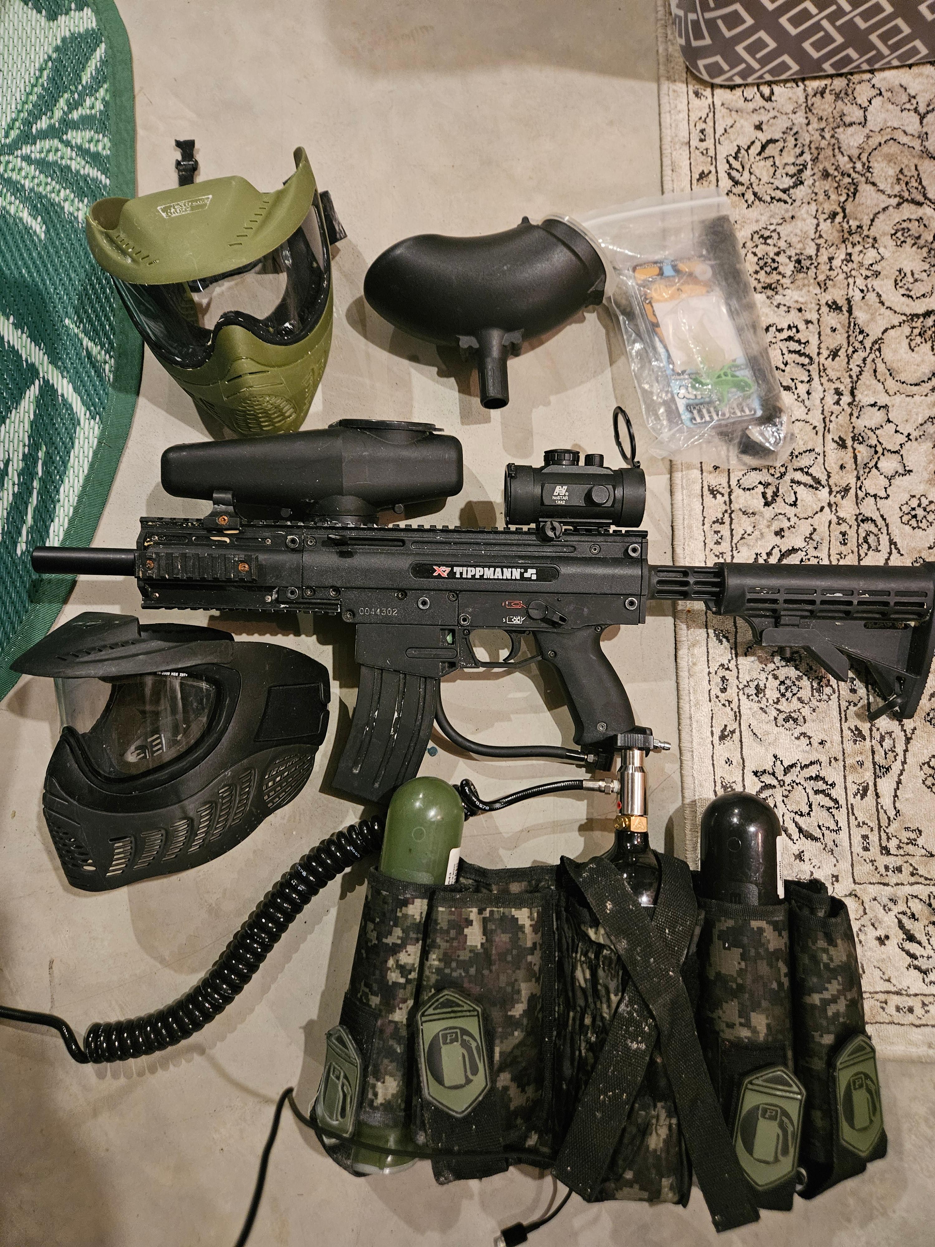 Photo of Tippman paintball gun and accessories. 