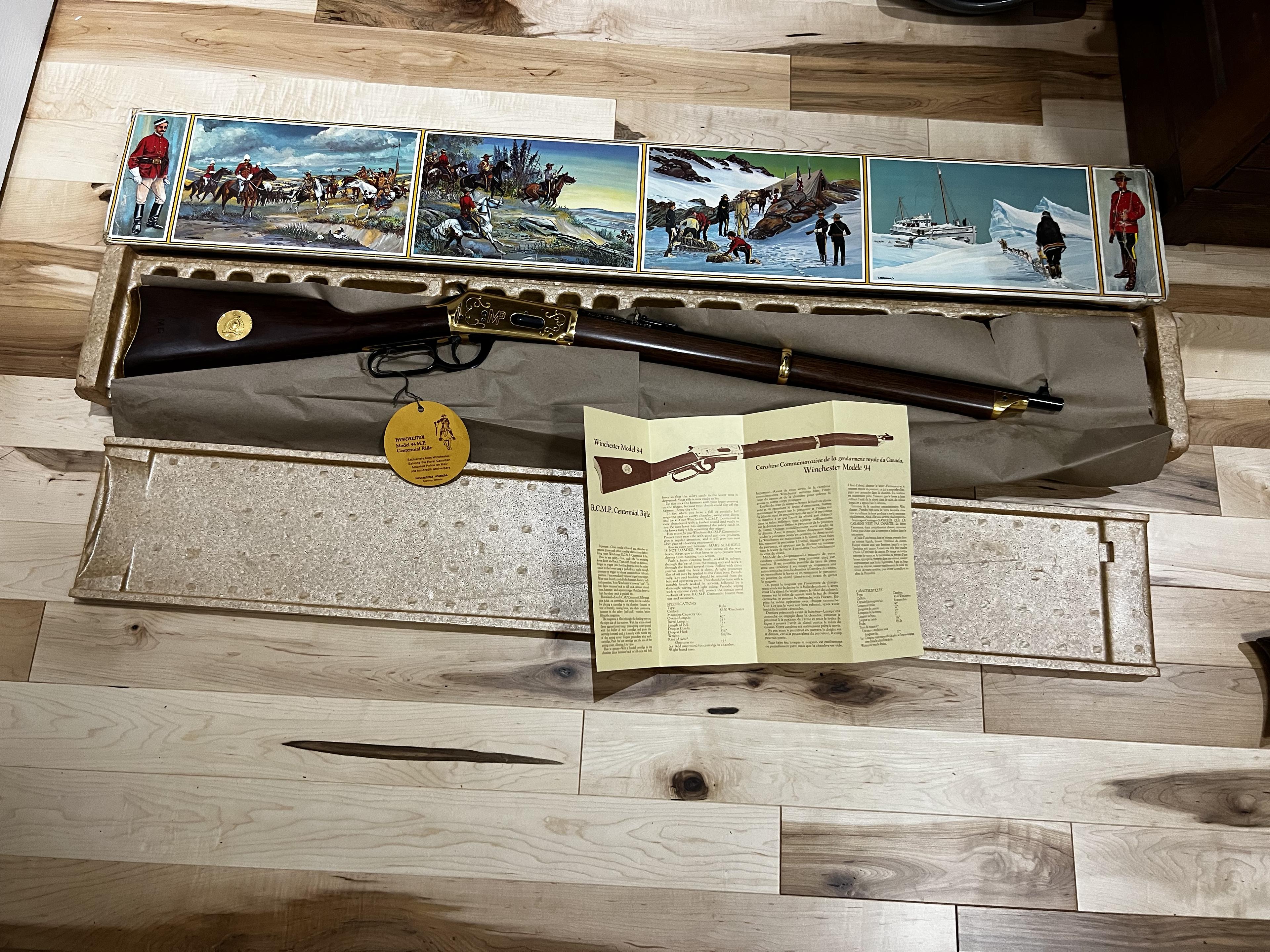 Photo of Winchester Rcmp MEMBERS model rifle complete with ceremonial sword and centennial photo portfolio