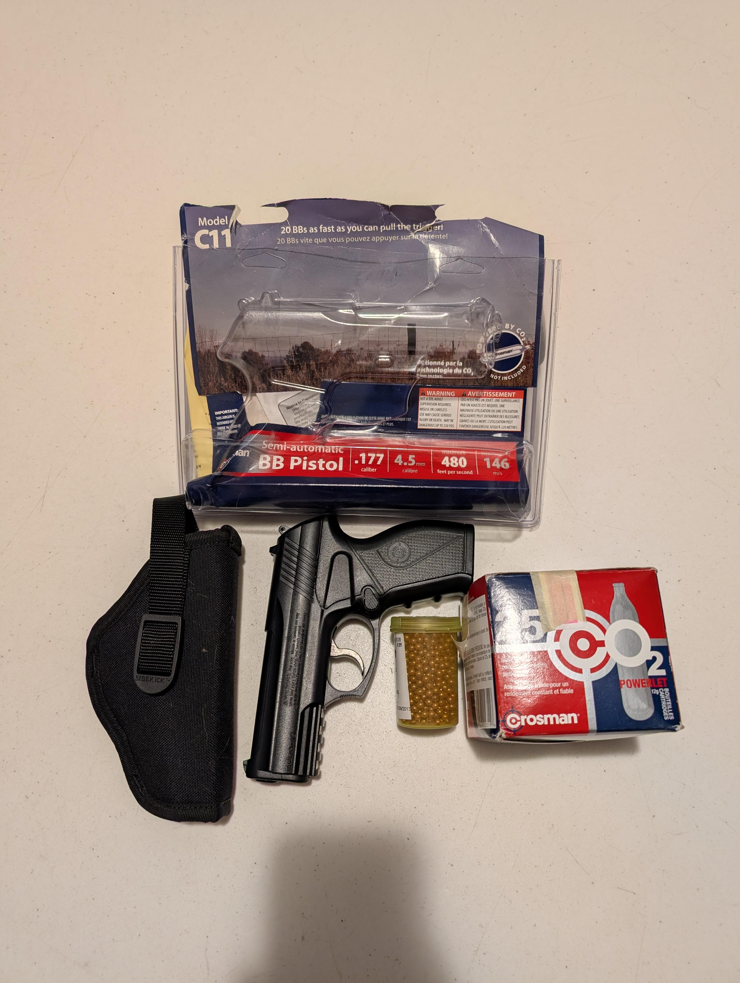 Photo of Semi-Automatic BB Pistol with BBs, Holster and CO2 Canisters