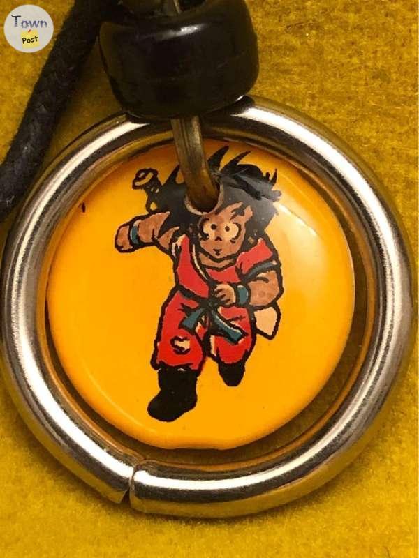 Photo of Dragon Ball Z necklace with Goku and Tien