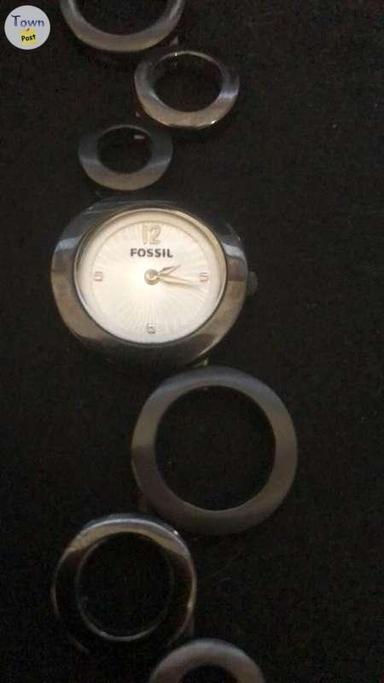 Photo of Fossil Woman E1915 silver link sunburst watch. - 2