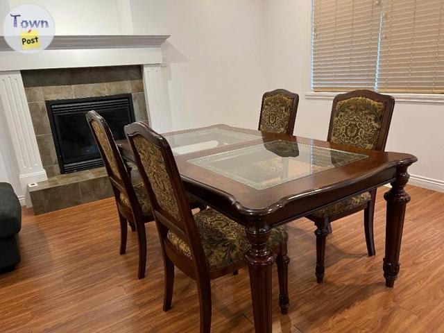 Photo of Table and chairs all wood 