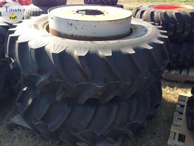 Photo of Michelin Titan 16.9x34 Tires R-1 on rims (2 count) - 1