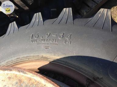 Photo of Michelin Titan 16.9x34 Tires R-1 on rims (2 count) - 2