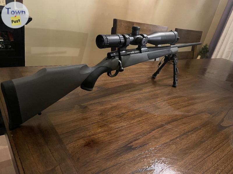 Photo of .338 winmag Weatherby Vanguard. Hawke Scope 3-12×50 Sidewinder Red Green Illuminated.