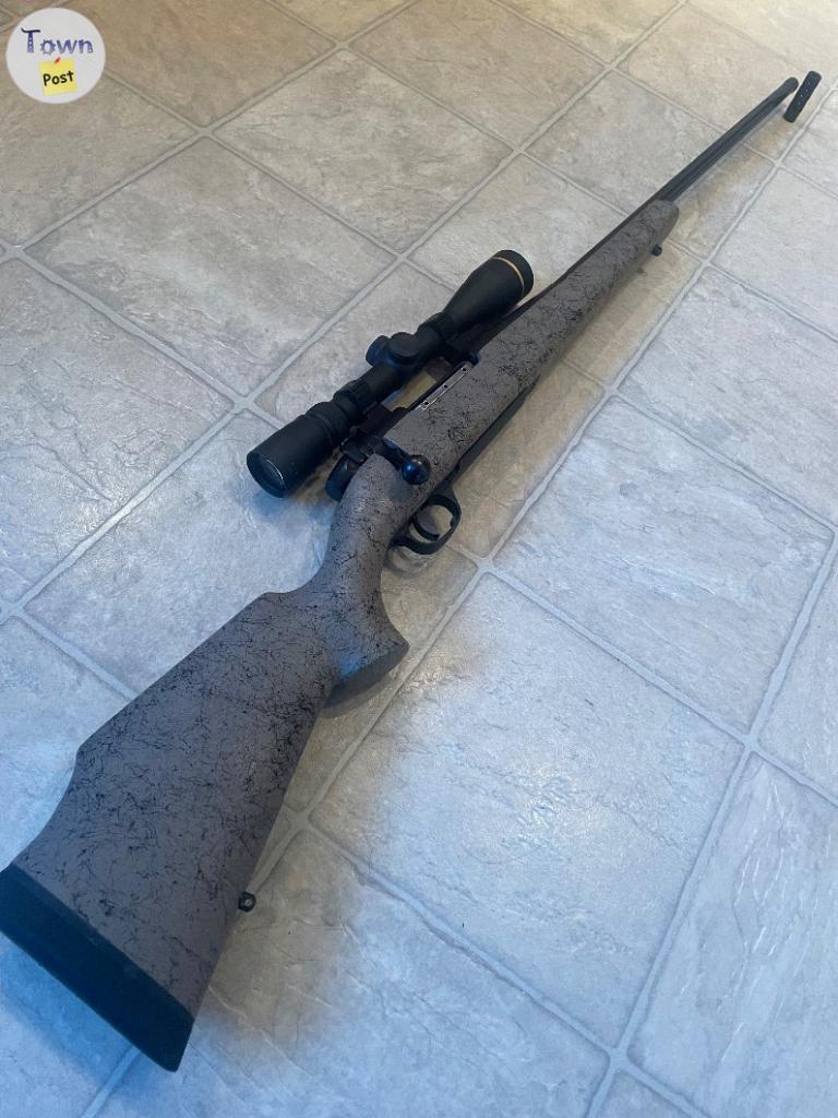 Photo of Weatherby mark V 6.5x300 with leupold scope