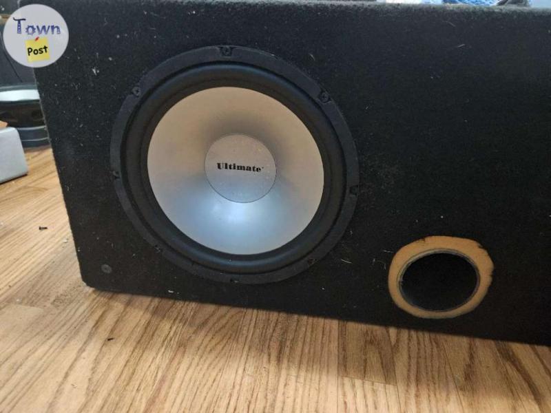 Photo of 10" subwoofer in big ported box 