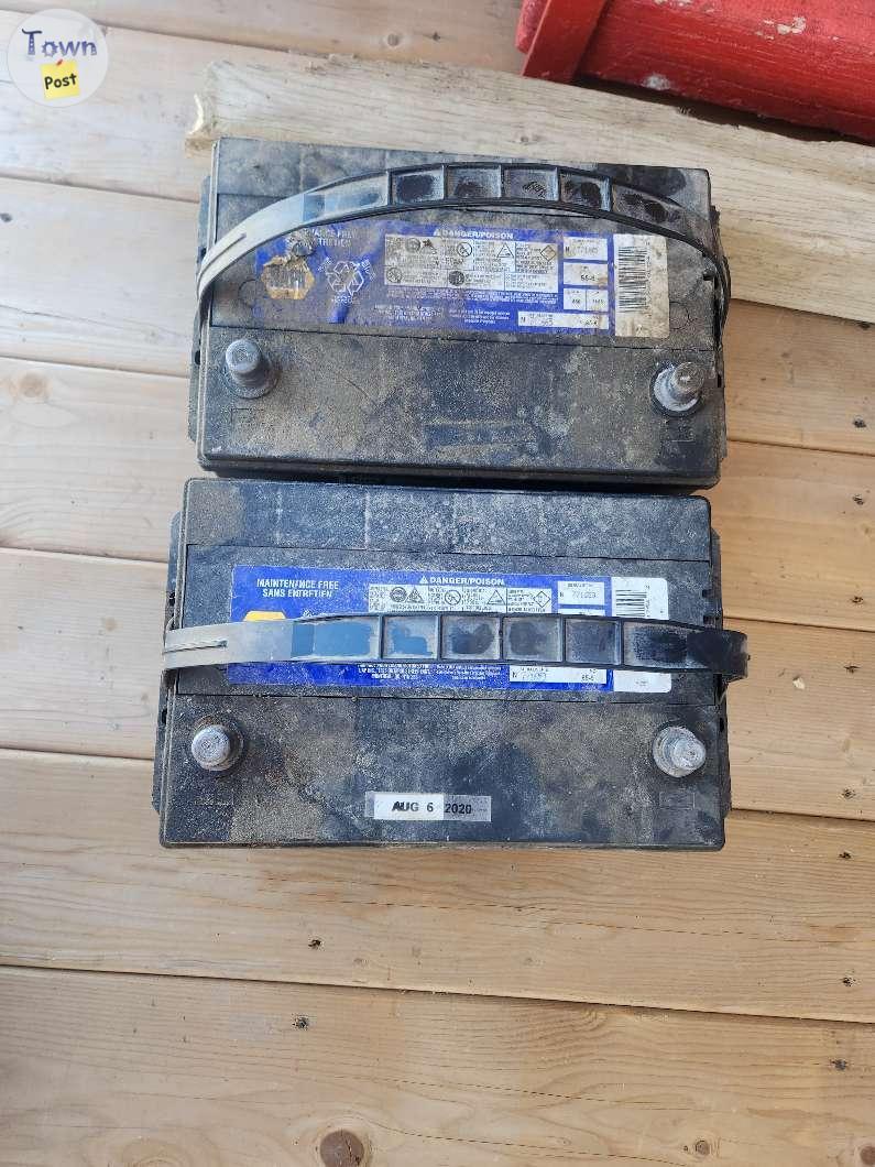 Photo of Two 12 volt batteries out of 2005 Dodge Laramie 3500 diesel