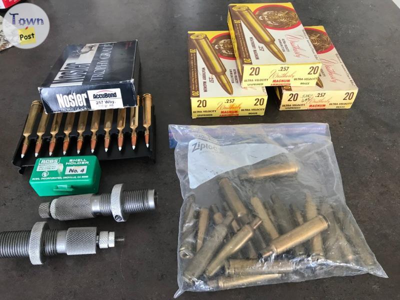 Photo of .257 shells, brass and reloading equipment 