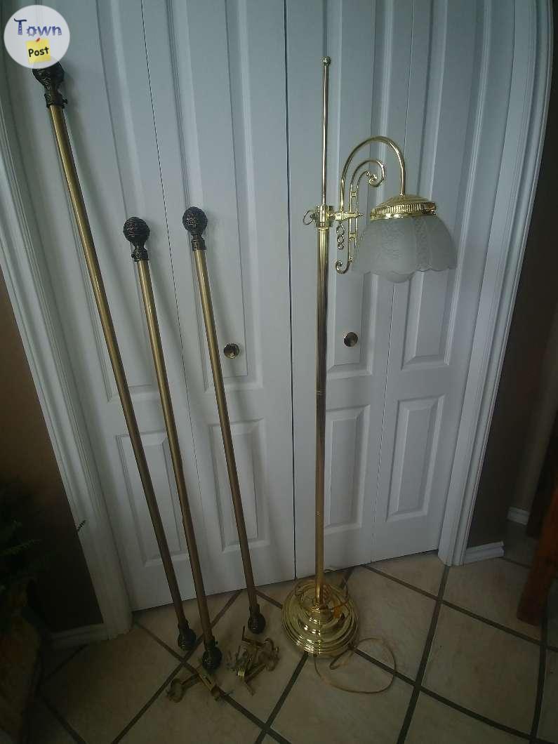 Photo of Curtain Rods & Brass Lamp