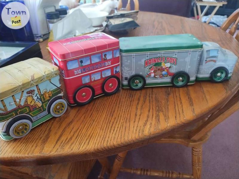 Photo of 3 unique tins with wheels 