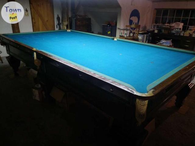 Photo of Antique pool table 