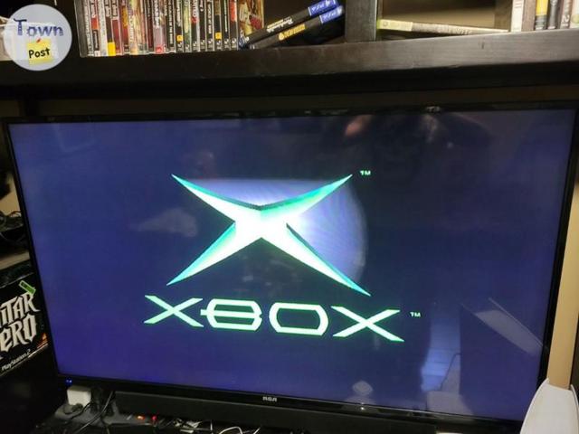 Photo of Original Xbox console and games