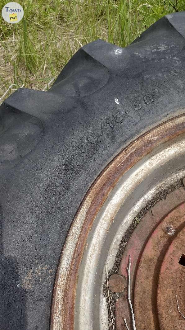 Photo of Heavy tractor wheels.  