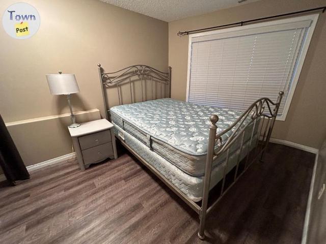 Photo of Queen bed frame with mattress 