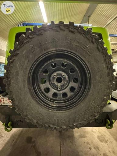 Photo of 5 X 35" Mickey Thompson MT Baja Boss with American racing wheels - 2