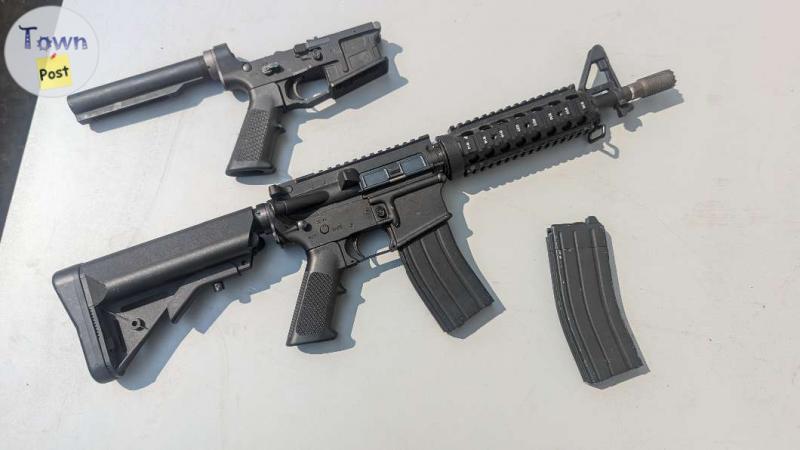 Photo of KJW GBBR AR-15 replica with 4 mags