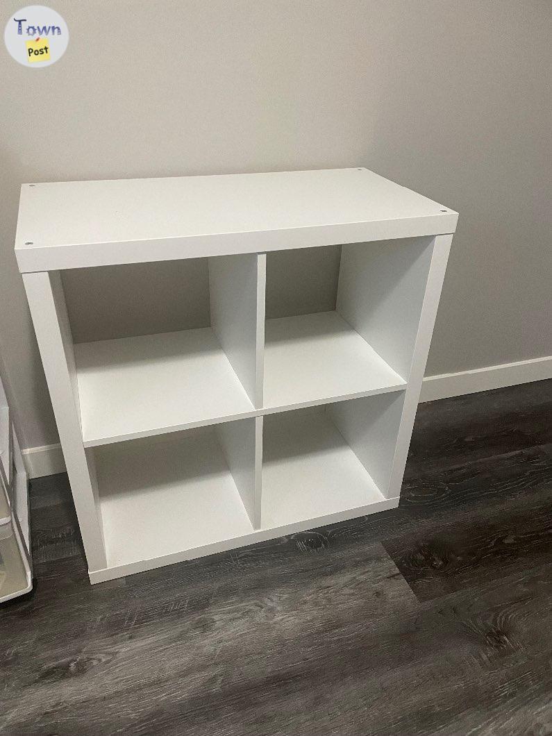 Photo of 2 white and 1 black Kalix shelves