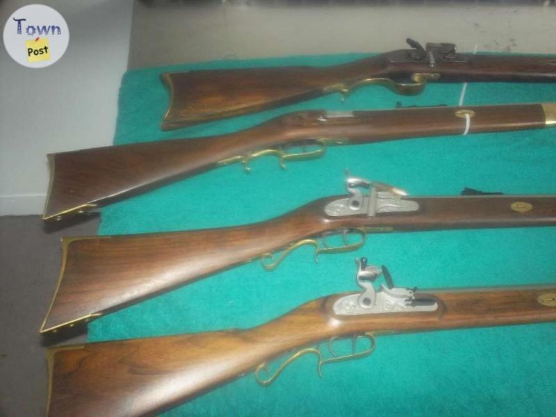 Photo of flint lock rifles and barrels