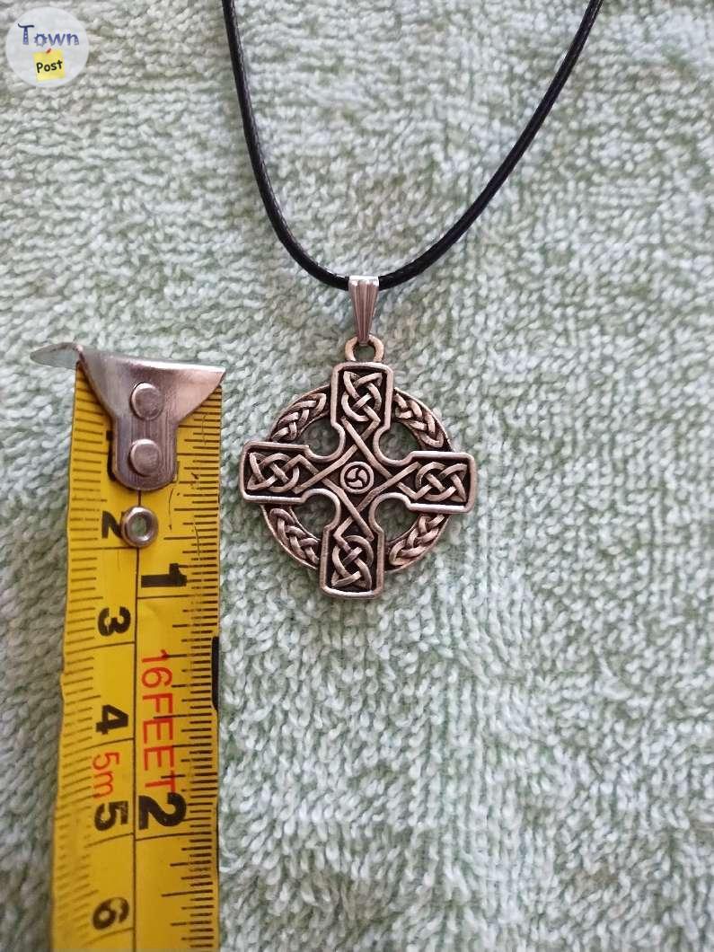 Photo of Celtic and flaming Crosses, skull necklaces 