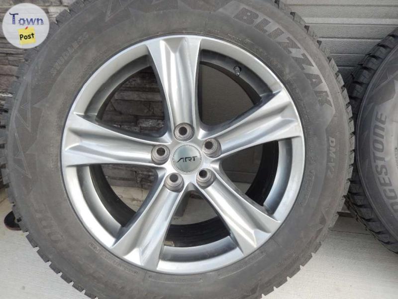 Photo of Bridgestone tires and rims