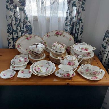 Photo of Royal Albert American Beauty 10 settings, teapot, 2 platters, covered casserole, vegetable bowl, salad bowl, cream and sugar, cake plate and more.  - 1