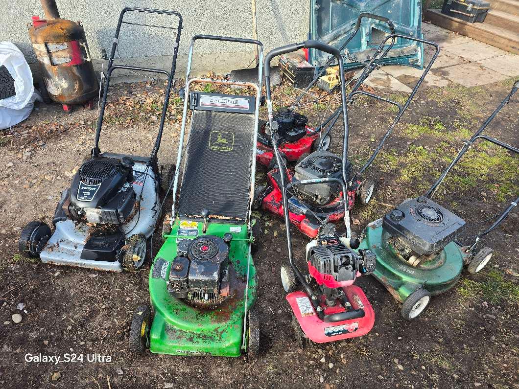 Photo of 4 lawn mowers and rototiller 