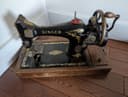 Photo of Antique portable singer hand crank sewing machine