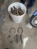 Photo of Assorted horse shoes and rail spikes