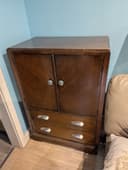 Photo of Refinished wooden cabinet with new hardware