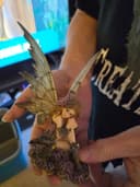 Photo of Small fairy statue located in woodbine