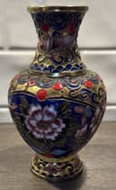 Photo of A vintage Chinese cloisonné vase with floral motifs and gold wire inlay.