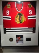 Photo of Bobbie Hull signed framed jersey, numbered
