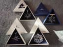 Photo of Swarovski snowflake ornaments 1995, 1997, 1999, 2010, in boxes with documents