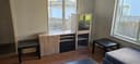 Photo of IKEA Entertainment center with glass bar / display section.