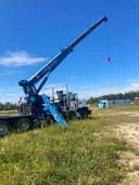 Photo of 1996 Mack 454 Tandem Steer Picker Truck.