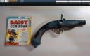 Photo of Antique Replica 18th century Pistol Single Shot and 1940's Daisy Gun Comic Book