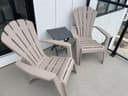 Photo of Plastic Adirondack chairs and table