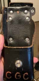 Photo of Motorola leather radio holster with strap.